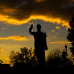 Torchbearer silhouetted