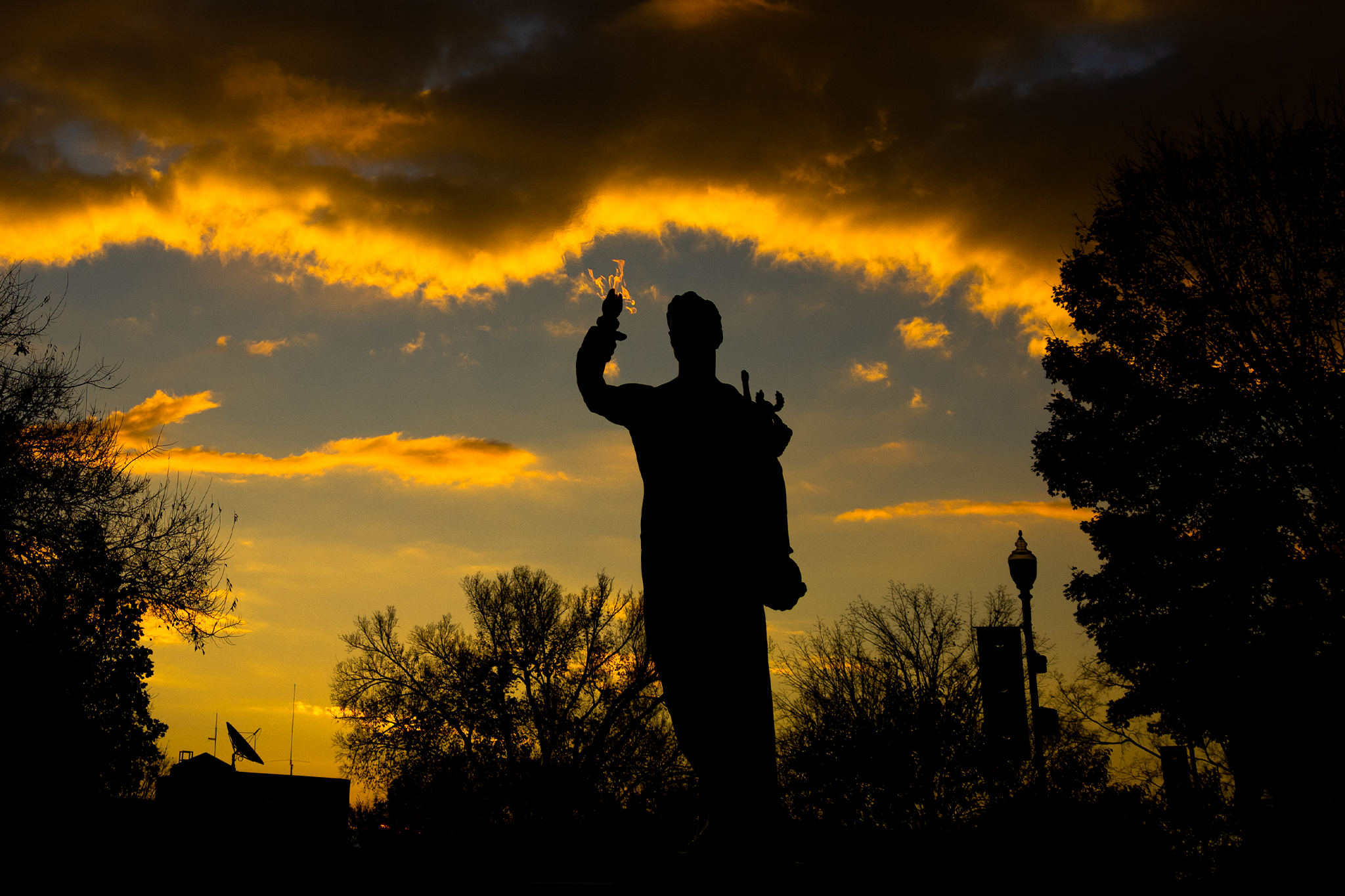 Torchbearer silhouetted