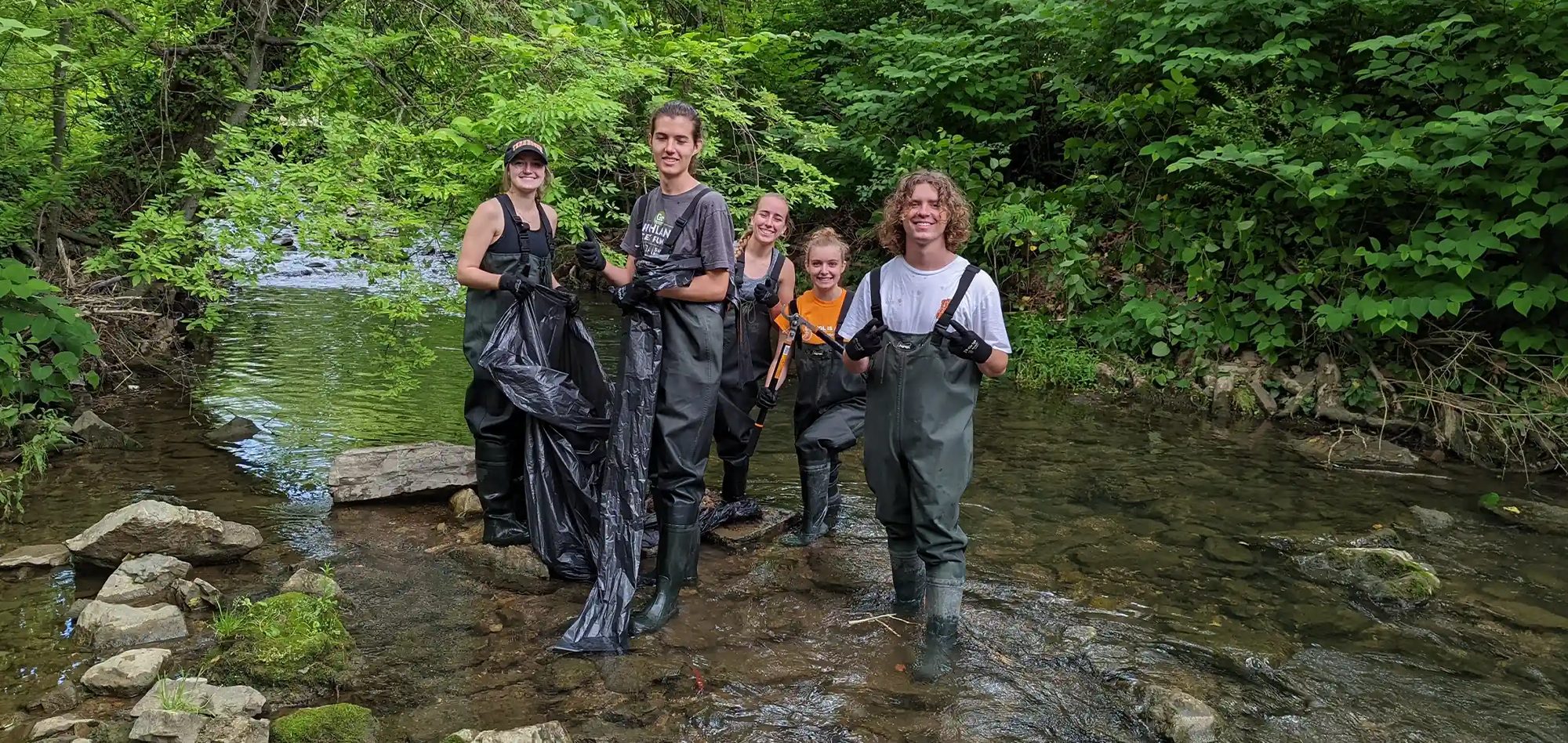 Geography and Sustainability Undergrads in creek